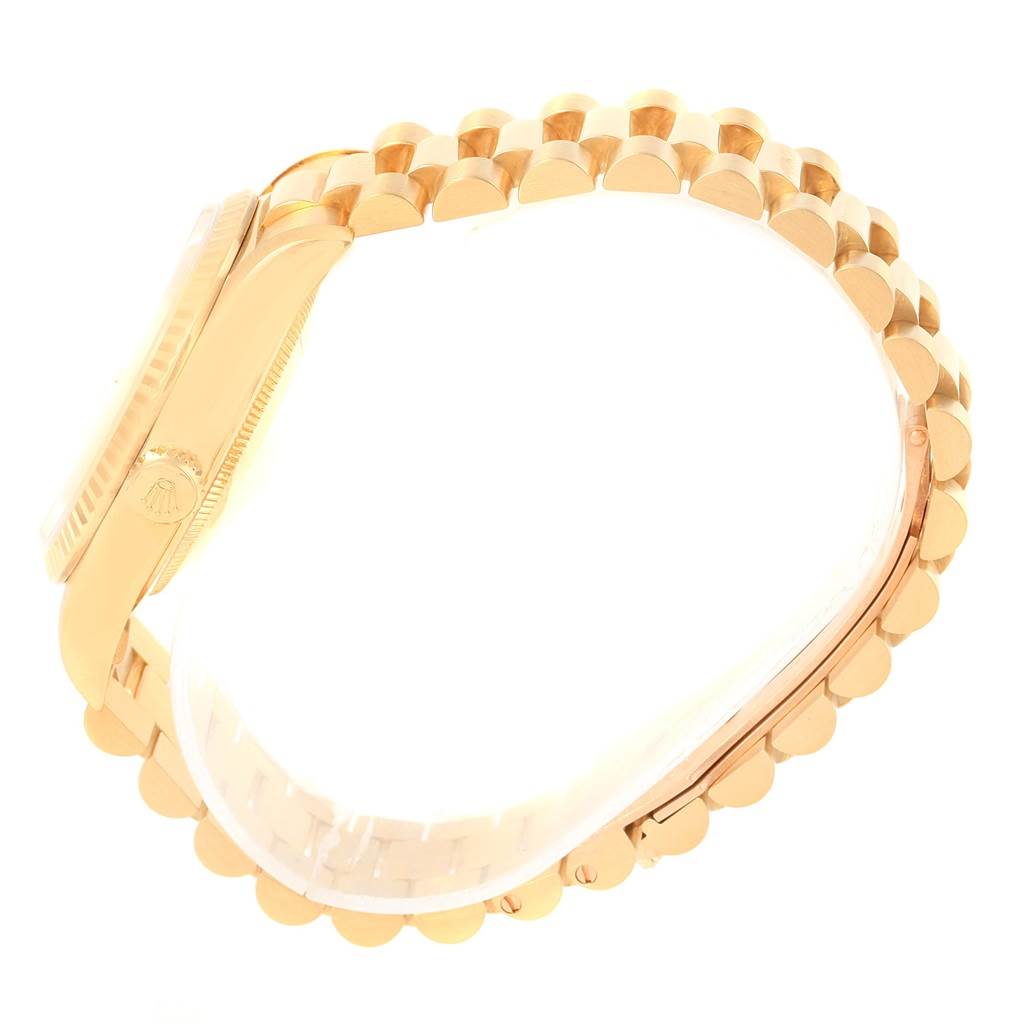 The image shows a side angle of the Rolex President 18238 Men's Yellow Gold Champagne Dial 18238 Men's Yellow Gold Champagne Dial model watch, highlighting its gold bracelet and case.