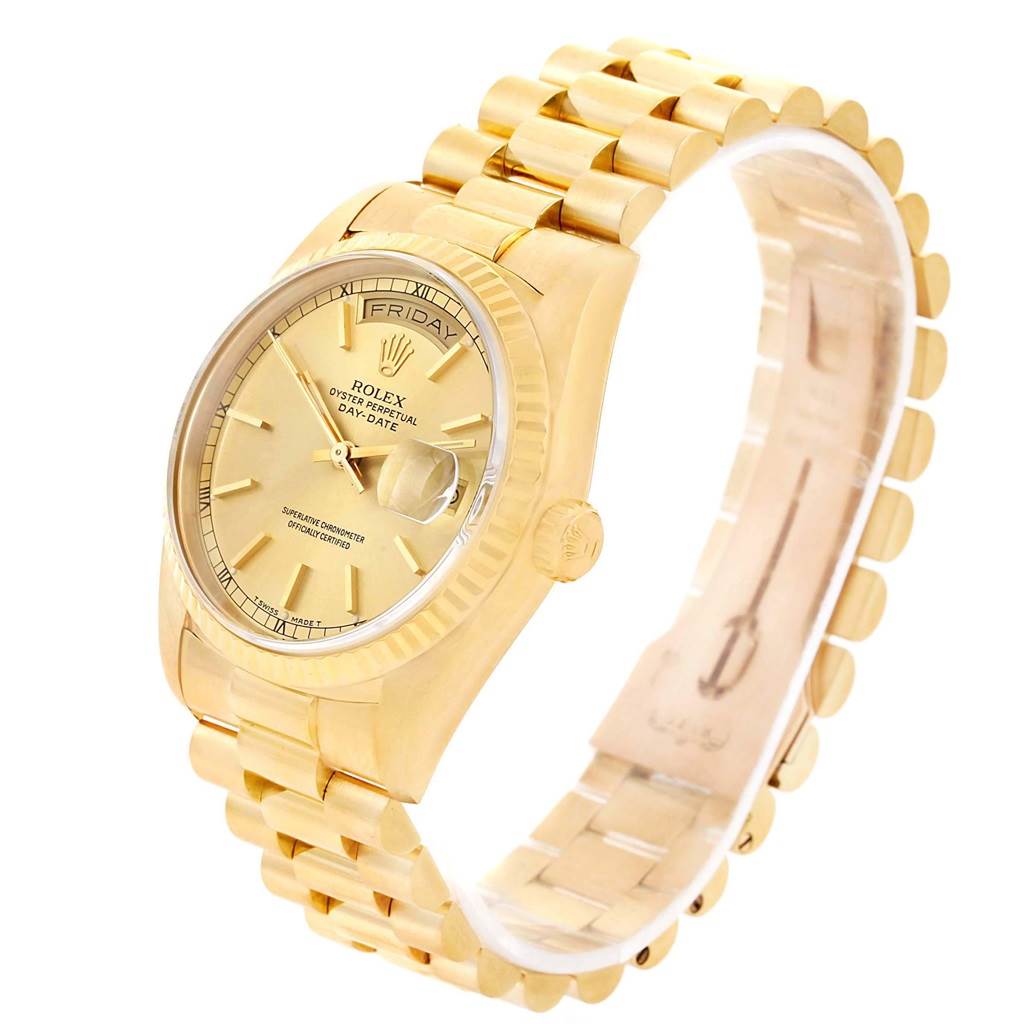 The Rolex President 18238 Men's Yellow Gold Champagne Dial 18238 Men's Yellow Gold Champagne Dial watch is shown at an angle highlighting its gold band, crown, and dial with day-date display.