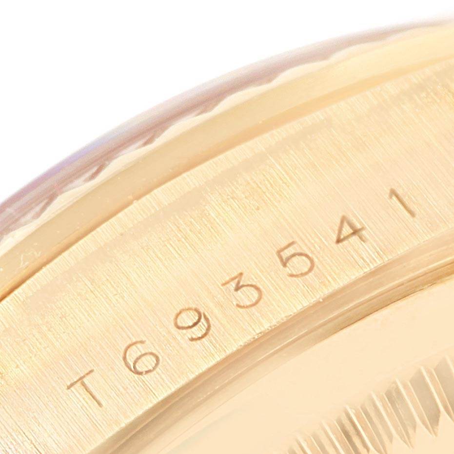 The image shows a close-up of the serial number engraving on the side of the Rolex President 18238 Men's Yellow Gold White Dial 18238 Men's Yellow Gold White Dial model watch case.