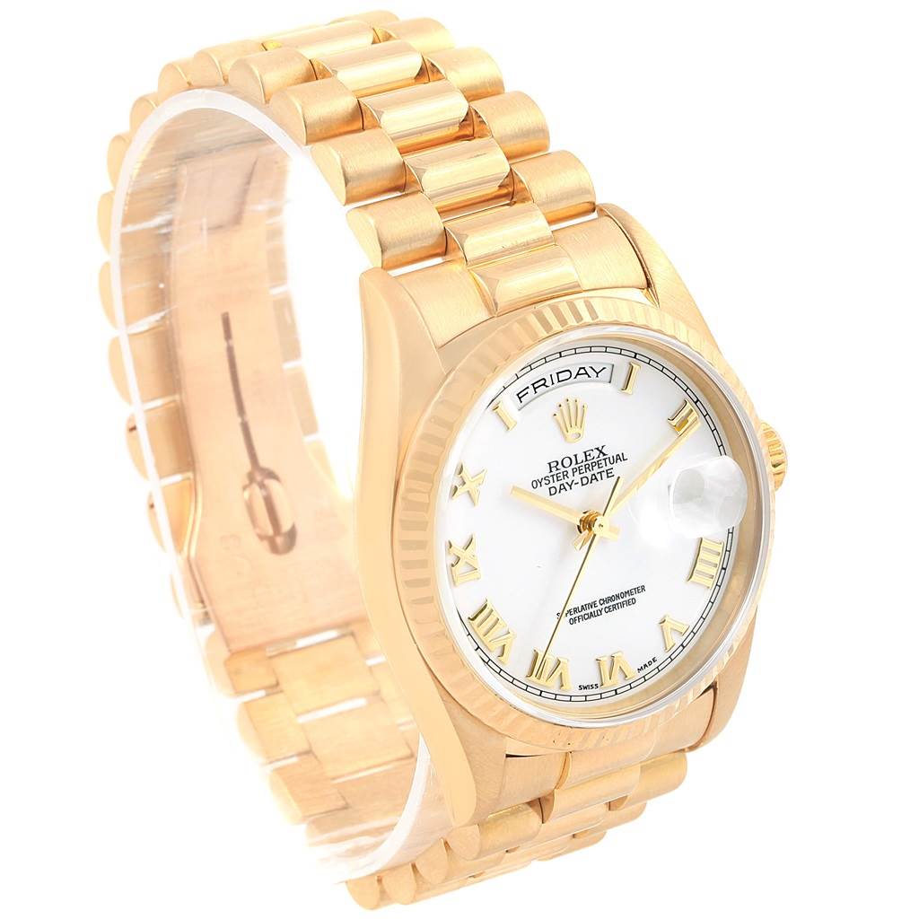 The photo shows a Rolex President 18238 Men's Yellow Gold White Dial 18238 Men's Yellow Gold White Dial model from a front-left angle, highlighting its gold bracelet, white dial, and day/date features.