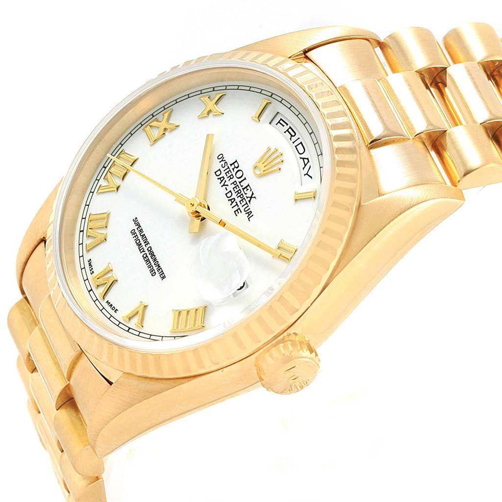The image shows a Rolex President 18238 Men's Yellow Gold White Dial 18238 Men's Yellow Gold White Dial model watch at an angle displaying its dial, day-date feature, crown, and bracelet.