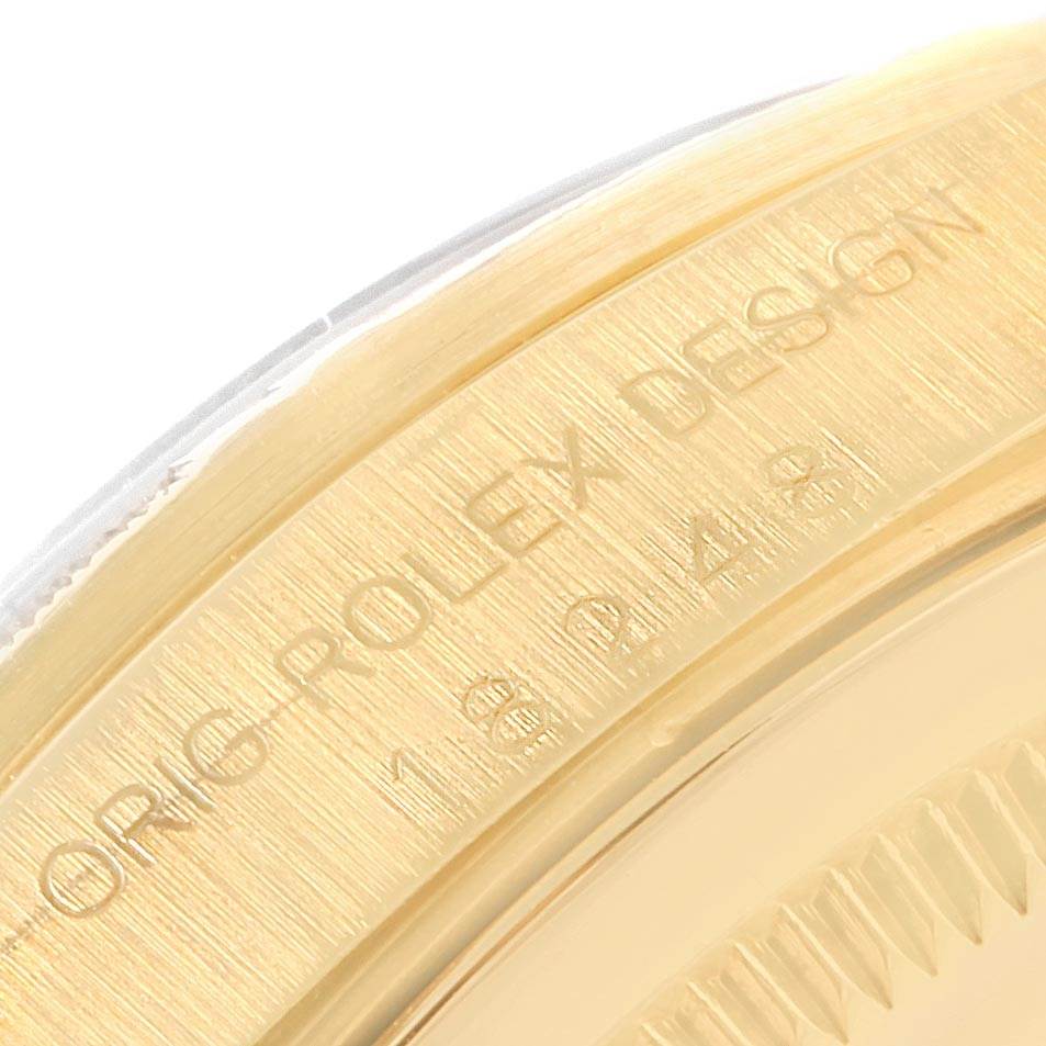 This close-up angle shows the inscription on the gold bezel of the Rolex President 18248 Men
s Yellow Gold White Dial 18248 Men
s Yellow Gold White Dial model.