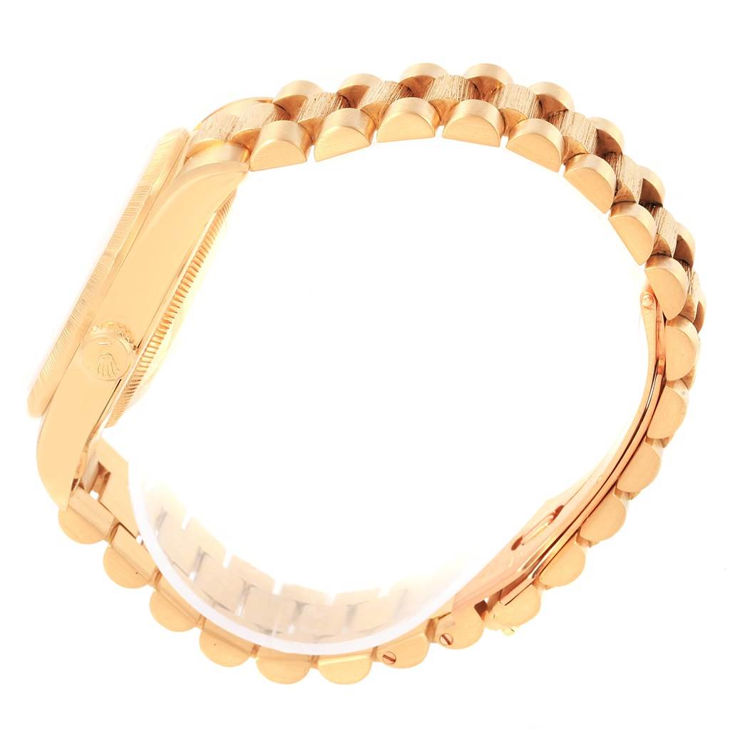 The image shows a side profile of a Rolex President 18248 Men
s Yellow Gold White Dial 18248 Men
s Yellow Gold White Dial model watch, highlighting the gold case and bracelet.