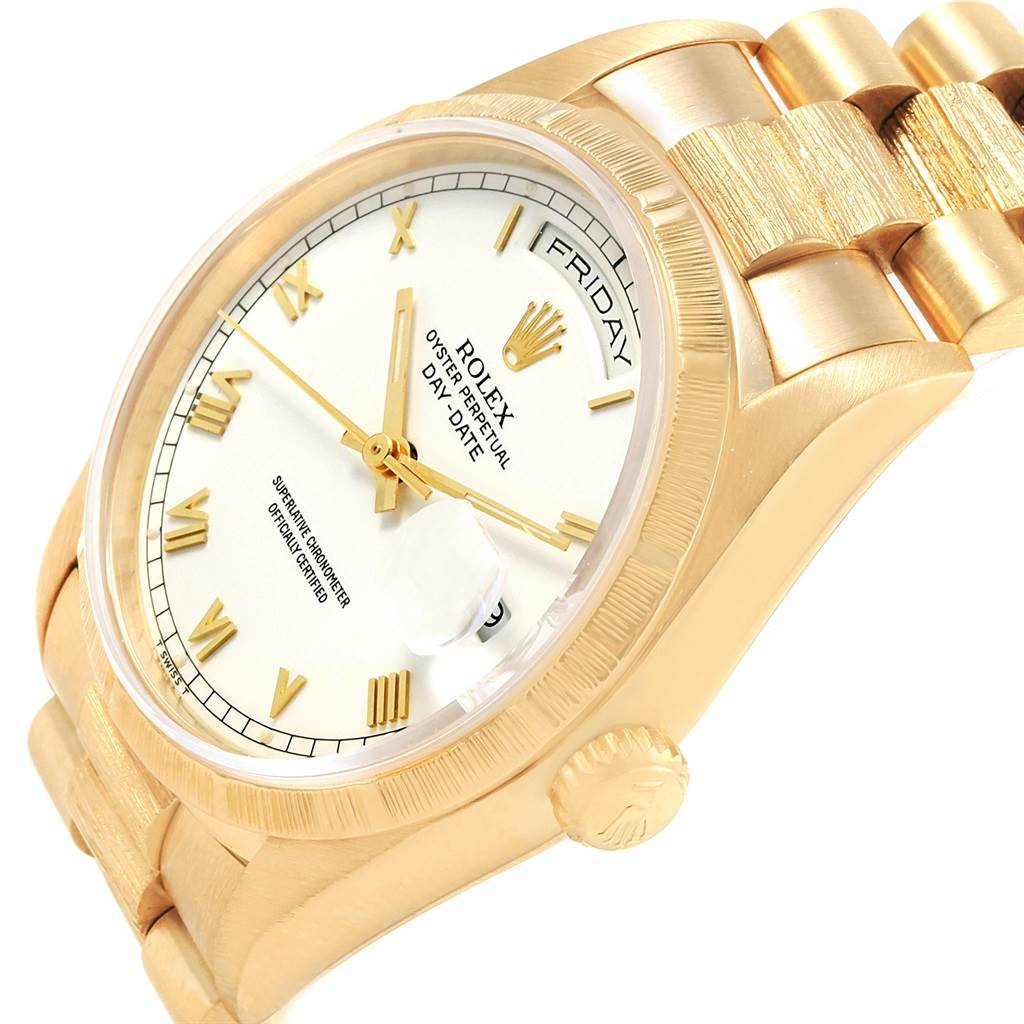 The image shows a side angle of the Rolex President 18248 Men
s Yellow Gold White Dial 18248 Men
s Yellow Gold White Dial model, highlighting the dial, crown, and part of the bracelet.