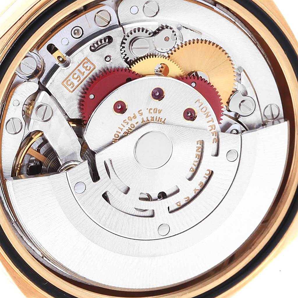 This image shows a close-up of the internal movement and gears of a Rolex President 18248 Men
s Yellow Gold White Dial 18248 Men
s Yellow Gold White Dial model watch.