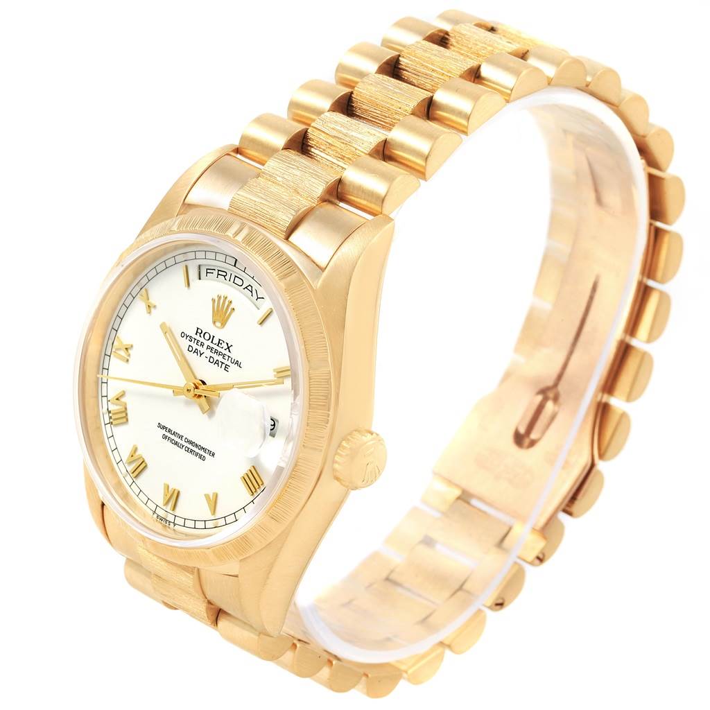 The image shows a Rolex President 18248 Men
s Yellow Gold White Dial 18248 Men
s Yellow Gold White Dial model watch from an angled side view, displaying the face, bezel, crown, and part of the bracelet.