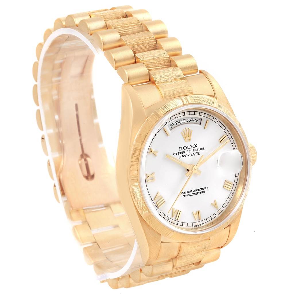 The image shows a Rolex President 18248 Men
s Yellow Gold White Dial 18248 Men
s Yellow Gold White Dial model watch from a side angle, displaying the gold bracelet, bezel, and dial with day/date feature prominently.