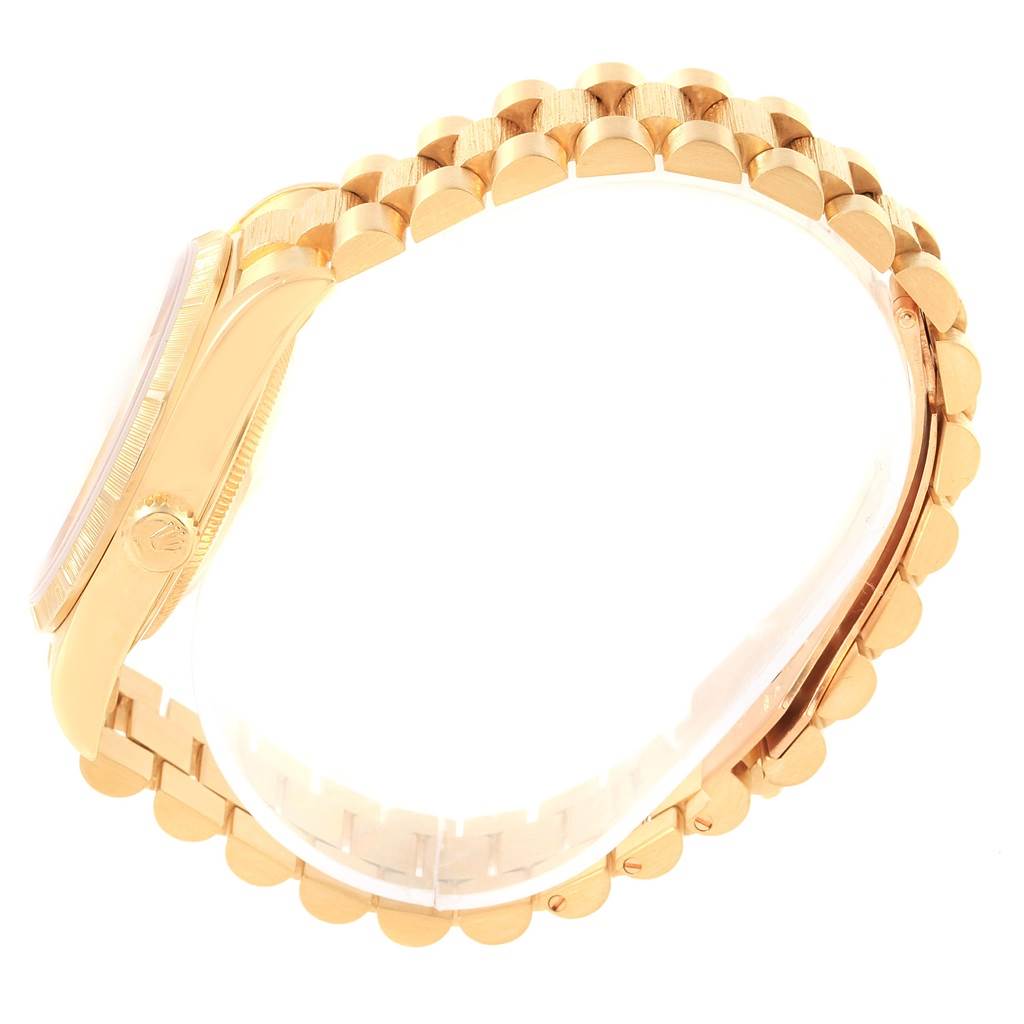 The image shows a side view of the Rolex President 18248 Men's Yellow Gold Mother of Pearl Dial 18248 Men's Yellow Gold Mother of Pearl Dial watch, highlighting the band and case.