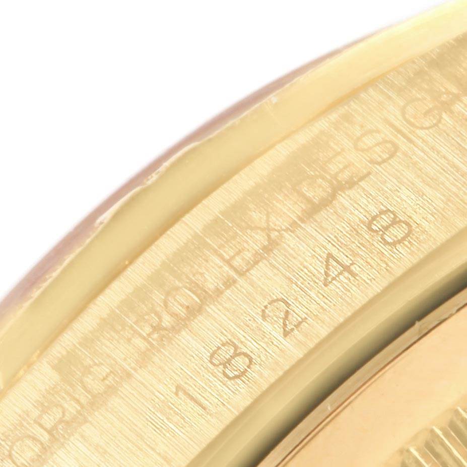 This image shows a close-up of the edge of the Rolex President 18248 Men's Yellow Gold Mother of Pearl Dial 18248 Men's Yellow Gold Mother of Pearl Dial model watch, highlighting the engraved numbers and text on the bezel.