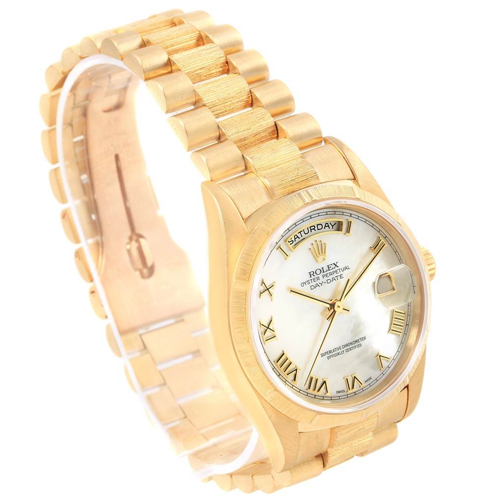 The Rolex President 18248 Men's Yellow Gold Mother of Pearl Dial 18248 Men's Yellow Gold Mother of Pearl Dial model watch is shown at a three-quarter angle, highlighting its gold bracelet, dial, and day-date display.