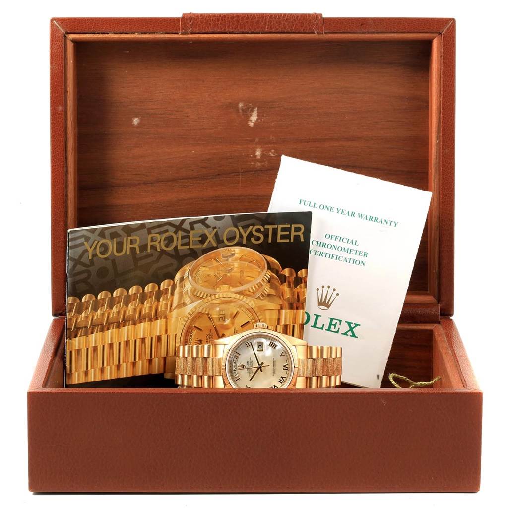 The image shows a Rolex President 18248 Men's Yellow Gold Mother of Pearl Dial 18248 Men's Yellow Gold Mother of Pearl Dial model watch and its accessories, including booklets and warranty, inside an open watch box.