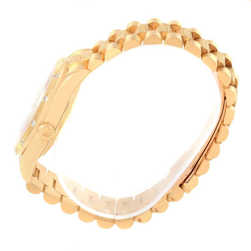 The image shows a side view of a Rolex President 18248 Men's Yellow Gold Brown Dial 18248 Men's Yellow Gold Brown Dial model watch band and case, highlighting its gold links and bezel.