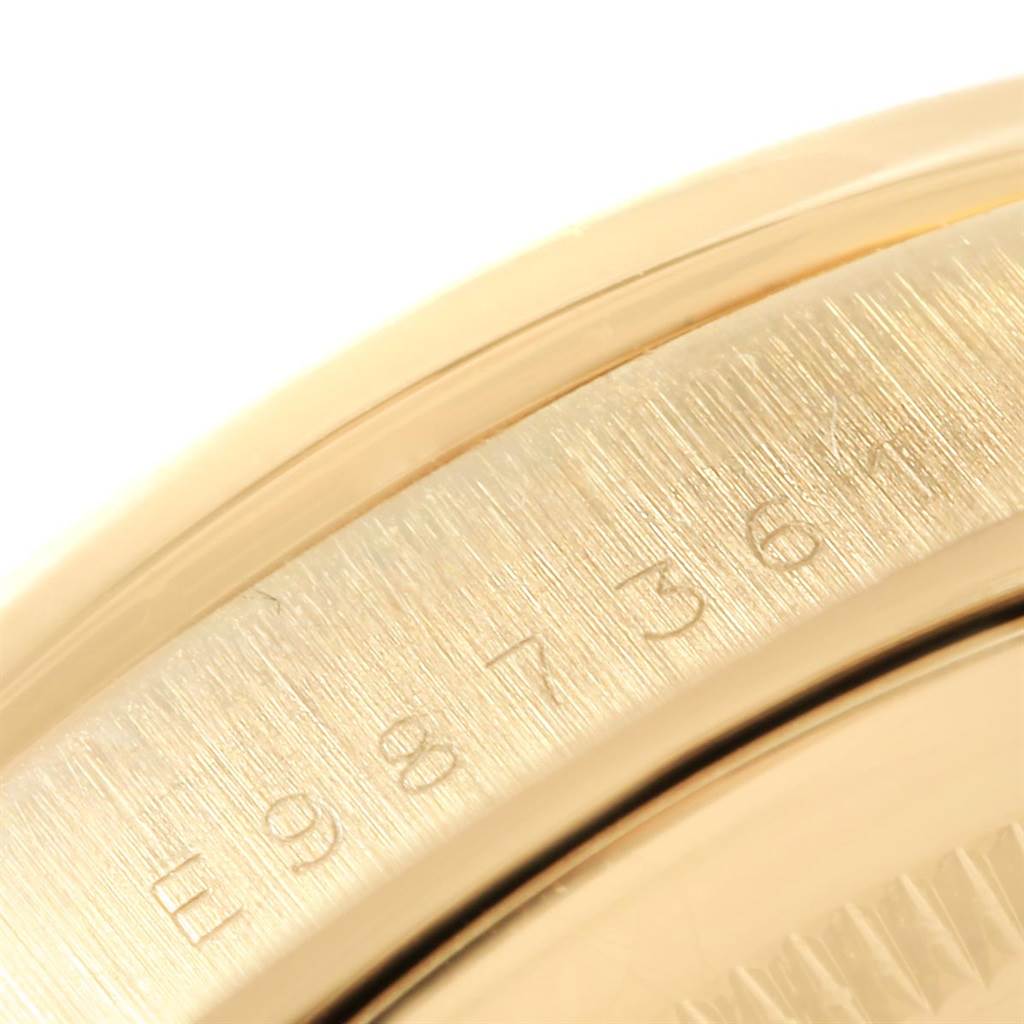 The image shows a close-up of the case side and serial number on a Rolex President 18248 Men's Yellow Gold Brown Dial 18248 Men's Yellow Gold Brown Dial model watch.