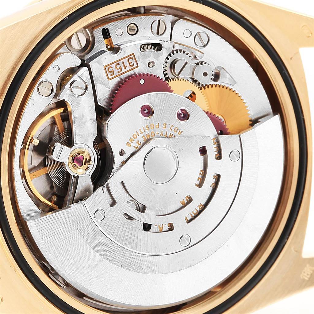 This image shows the internal mechanism of a Rolex President 18248 Men's Yellow Gold Brown Dial 18248 Men's Yellow Gold Brown Dial watch, specifically its movement and gears, from a back view.