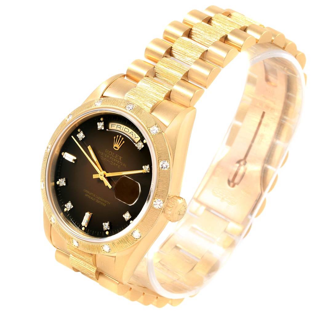 This Rolex President 18248 Men's Yellow Gold Brown Dial 18248 Men's Yellow Gold Brown Dial model watch is shown at a 3/4 angle, displaying its gold bracelet, black face, and bezel with diamond hour markers.