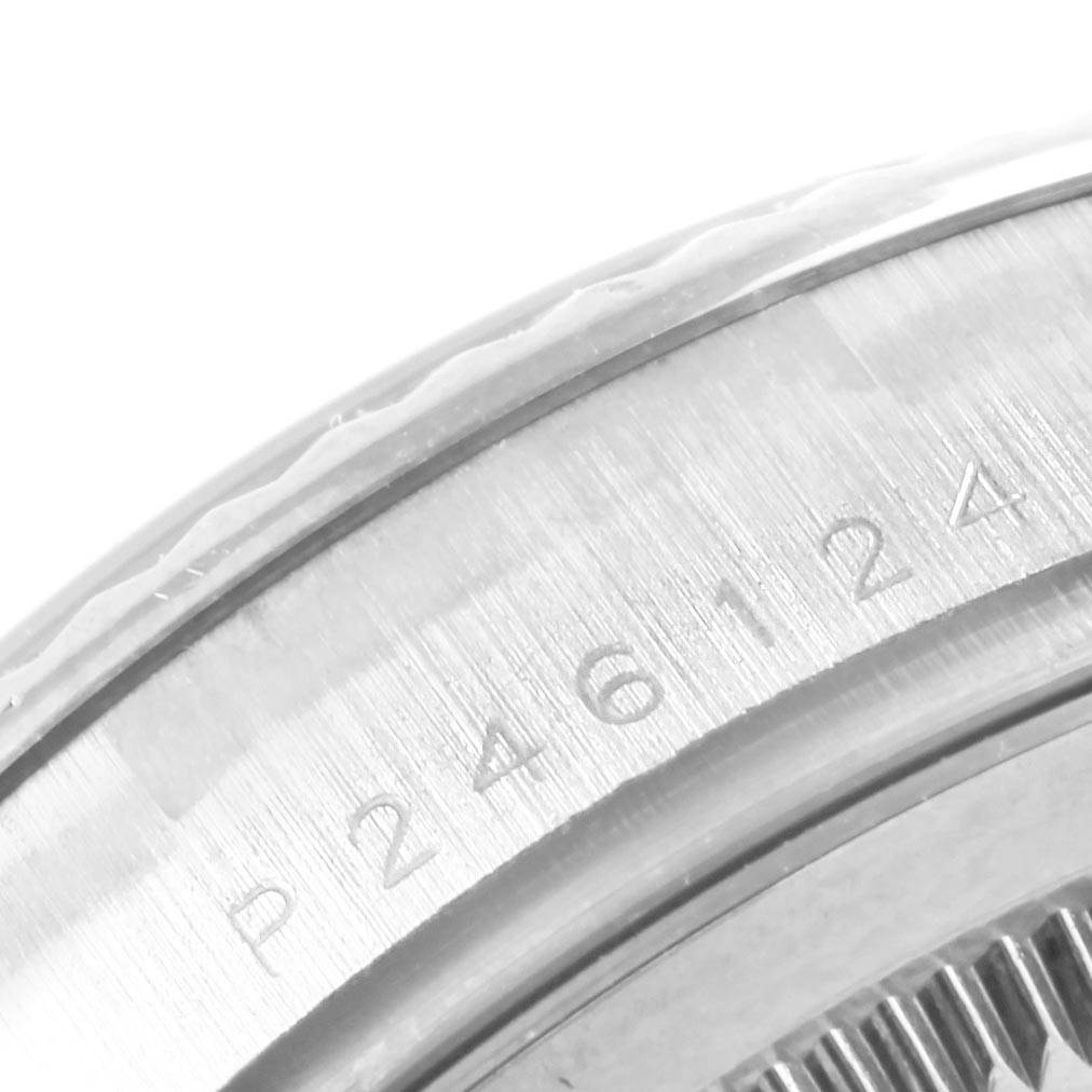 This is a close-up of the serial number engraving on the bezel of the Rolex President 118239 Men's White Gold Silver Dial 118239 Men's White Gold Silver Dial model watch.