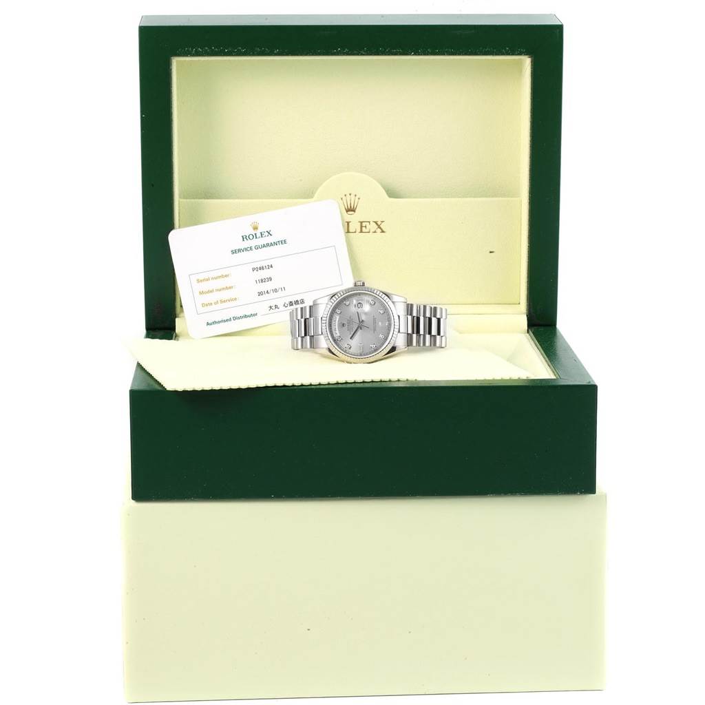 A Rolex President 118239 Men's White Gold Silver Dial 118239 Men's White Gold Silver Dial model watch is shown from a front angle, inside its green box with a service guarantee card.