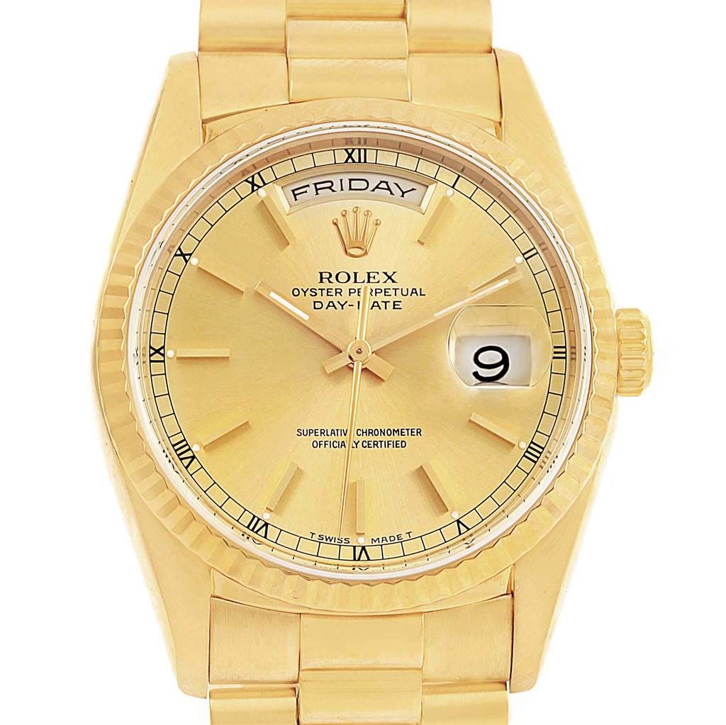 This is a close-up front view of the Rolex President 18238 Men
s Yellow Gold Champagne Dial 18238 Men
s Yellow Gold Champagne Dial model, showing the dial, hands, day-date display, bezel, and part of the bracelet.