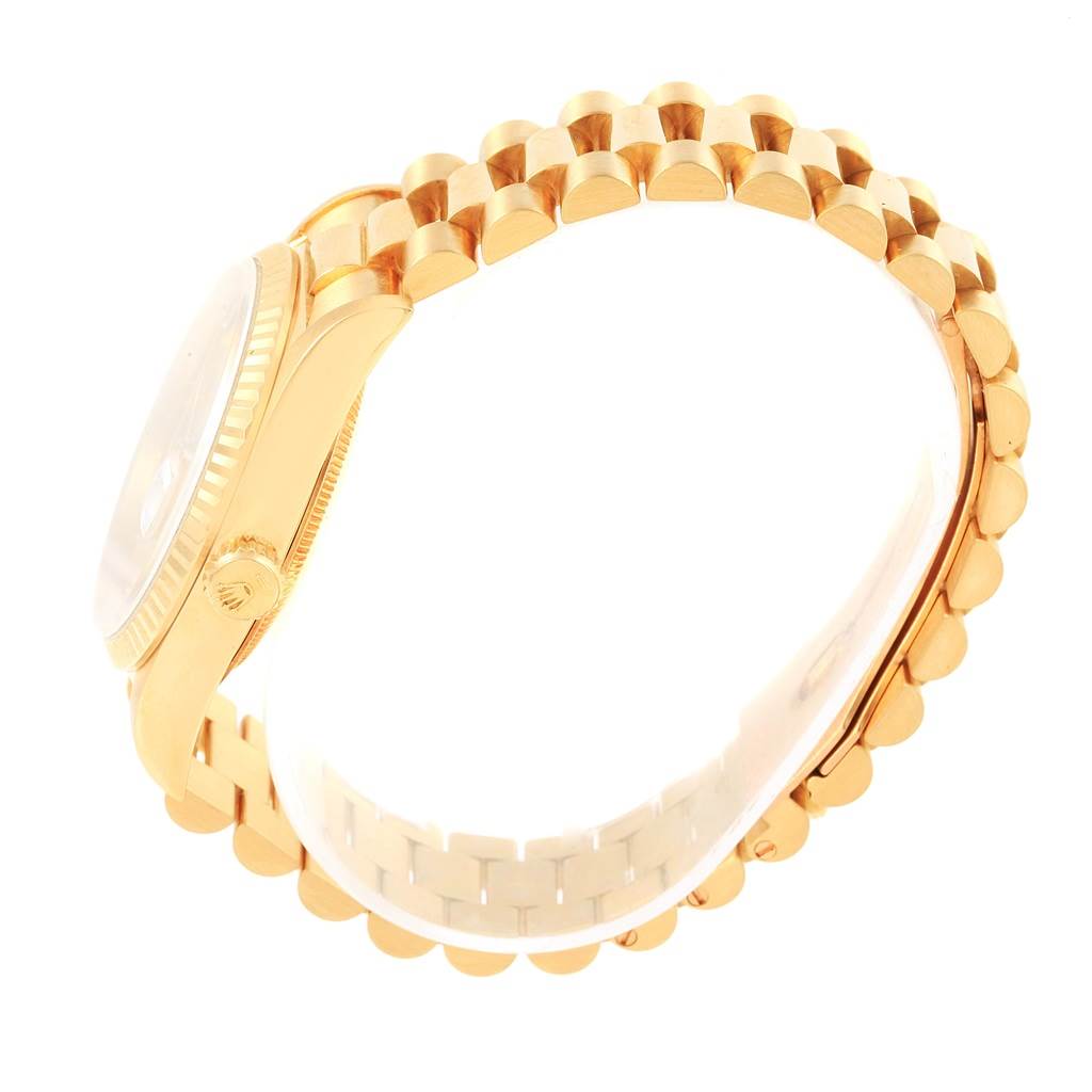 The image shows a side view of the gold casing and bracelet of the Rolex President 18238 Men
s Yellow Gold Champagne Dial 18238 Men
s Yellow Gold Champagne Dial model.