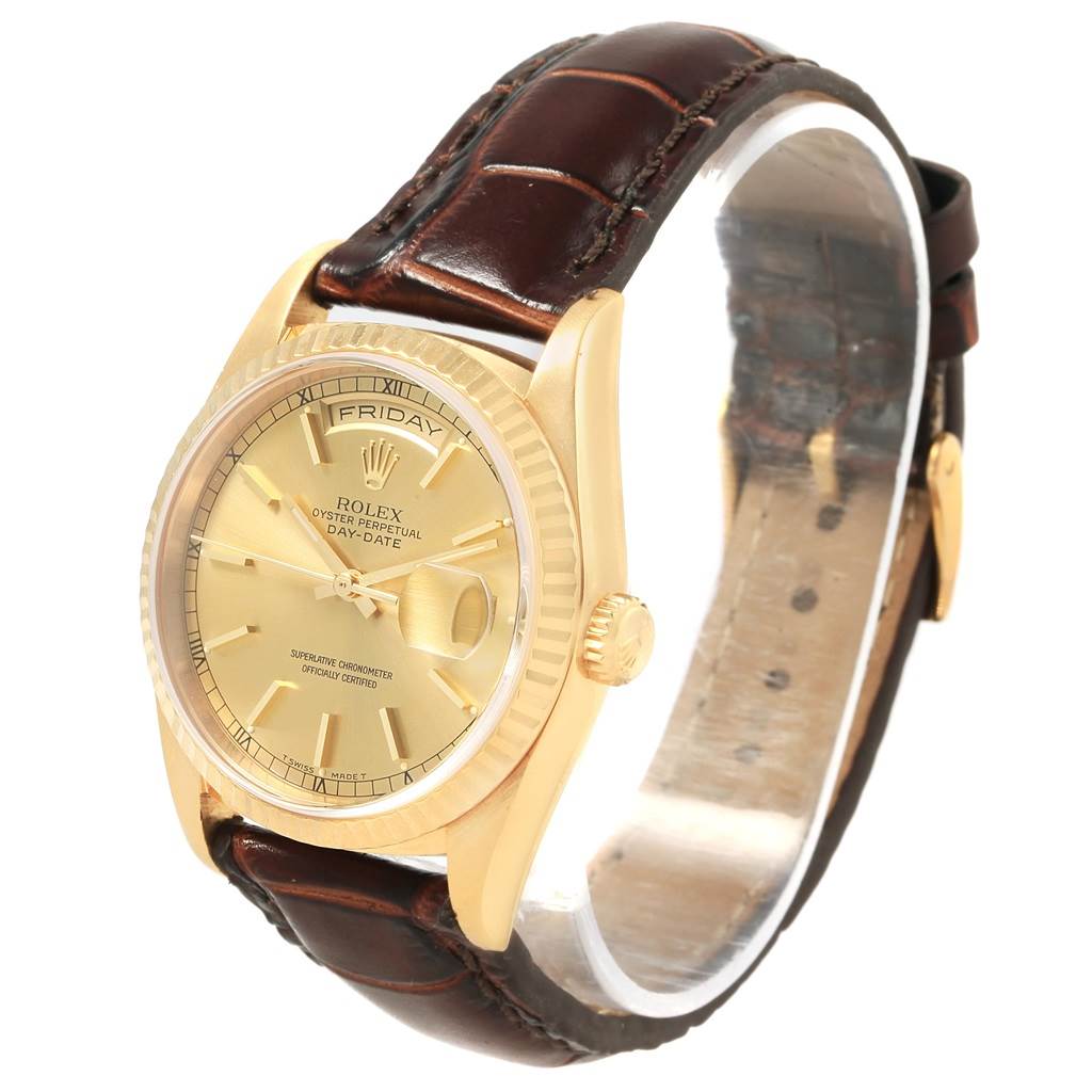 This image shows a Rolex President 18238 Men's Yellow Gold Champagne Dial 18238 Men's Yellow Gold Champagne Dial model watch at an angled side view, highlighting its gold case, dial, and brown leather strap.