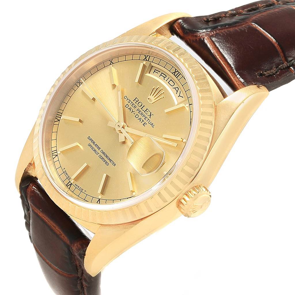 This image shows a diagonal close-up of a Rolex President 18238 Men's Yellow Gold Champagne Dial 18238 Men's Yellow Gold Champagne Dial model, highlighting the dial, bezel, crown, and leather strap.