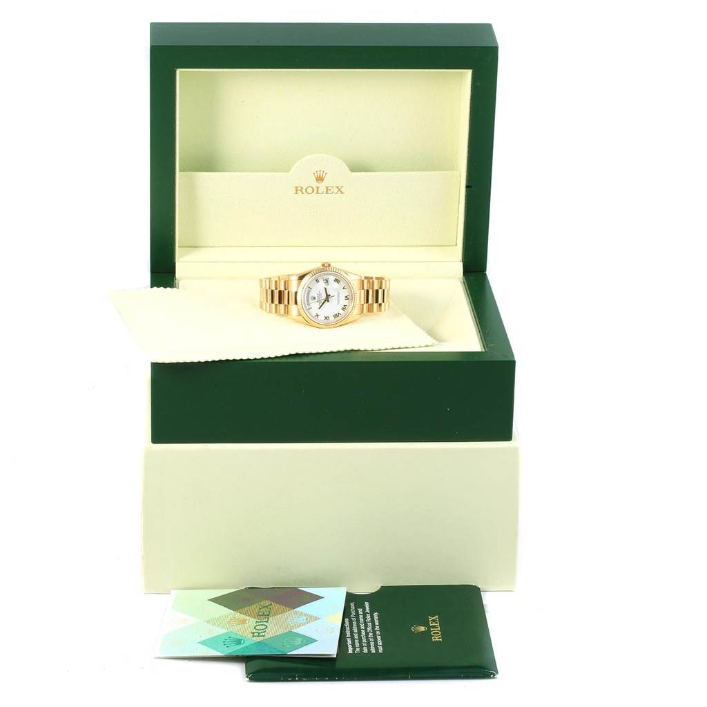 The image shows a Rolex President 118238 Men's Yellow Gold White Dial 118238 Men's Yellow Gold White Dial model watch in its open box, along with a cleaning cloth and paperwork.