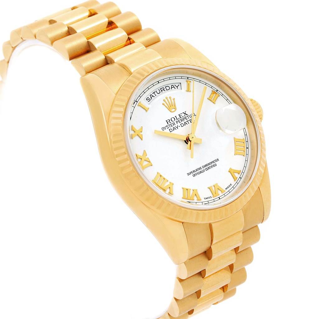 This image shows a President model Rolex watch at a slight angle, revealing its gold bracelet, dial, and bezel.