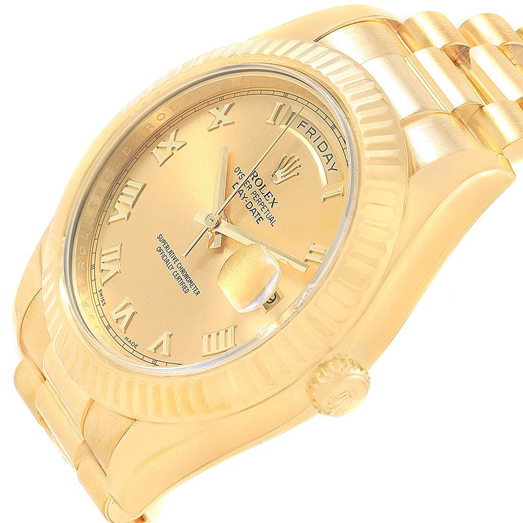 The Rolex President 218238 Men's Yellow Gold Champagne Dial 218238 Men's Yellow Gold Champagne Dial model watch is shown at an angled close-up, highlighting its gold dial, fluted bezel, and part of the bracelet.