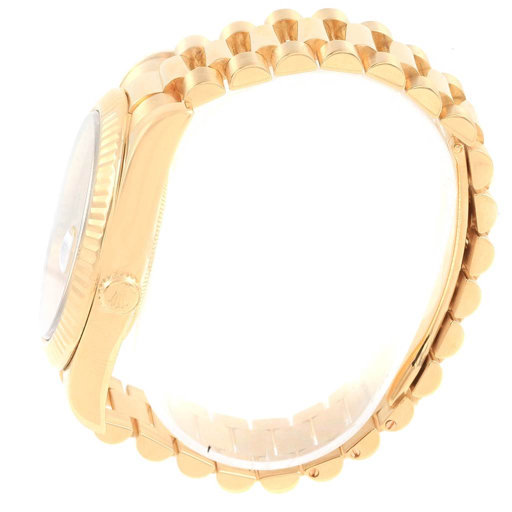 The image shows a side view of the Rolex President 218238 Men's Yellow Gold Champagne Dial 218238 Men's Yellow Gold Champagne Dial model watch, focusing on its case, crown, and bracelet.