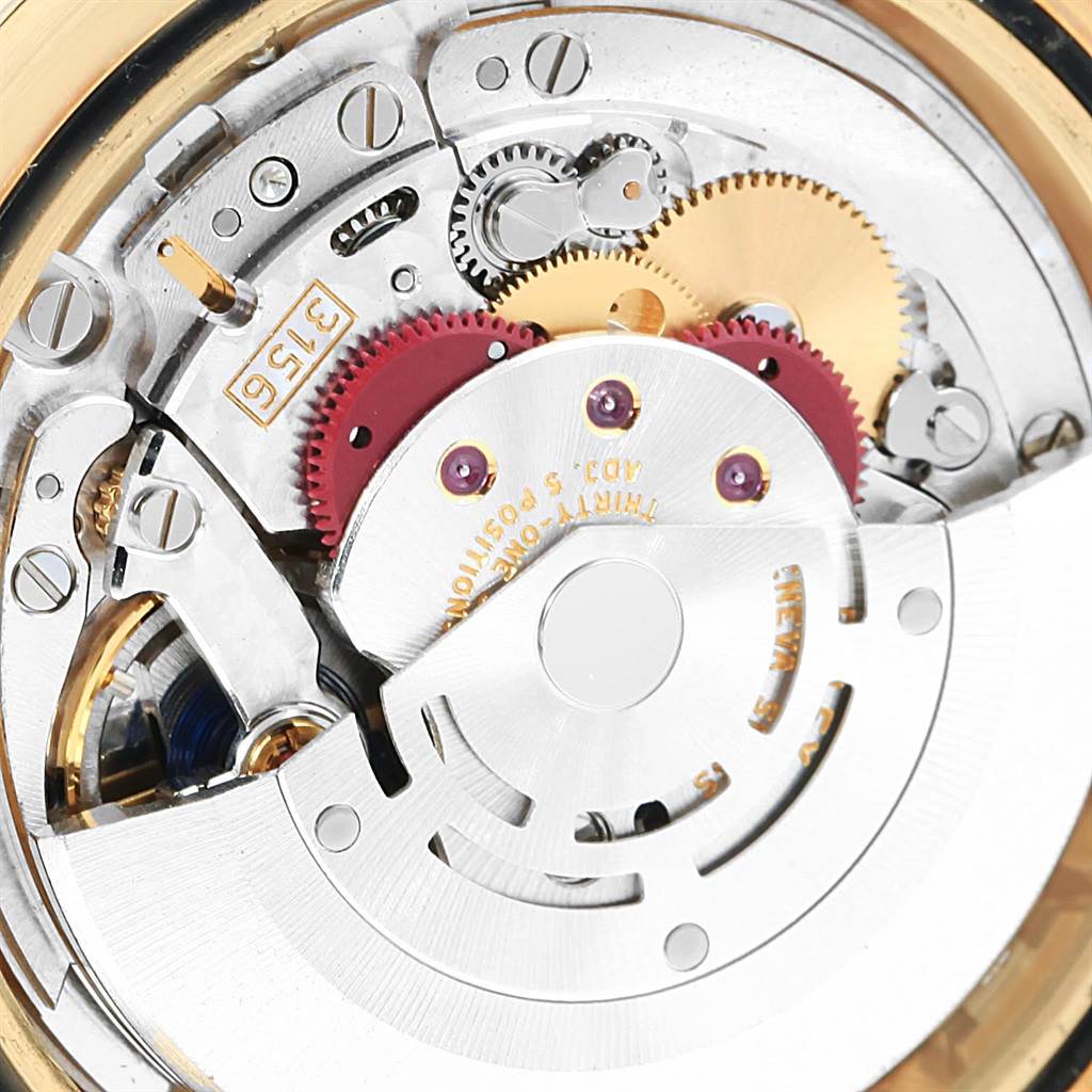 Close-up view of the movement parts of a Rolex President 218238 Men's Yellow Gold Champagne Dial 218238 Men's Yellow Gold Champagne Dial model, showing gears and components.