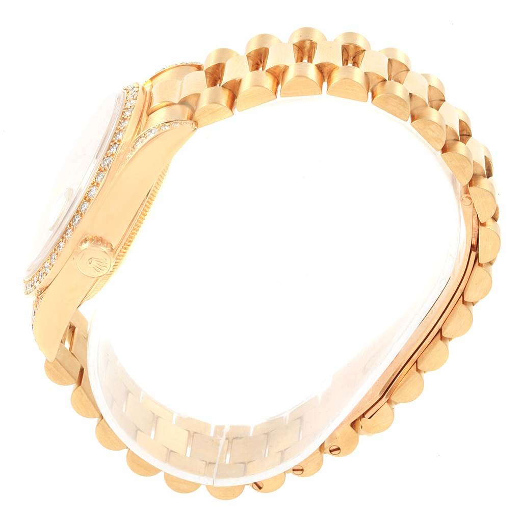 The image shows a side view of the President model by Rolex, highlighting the bezel, crown, and part of the bracelet.