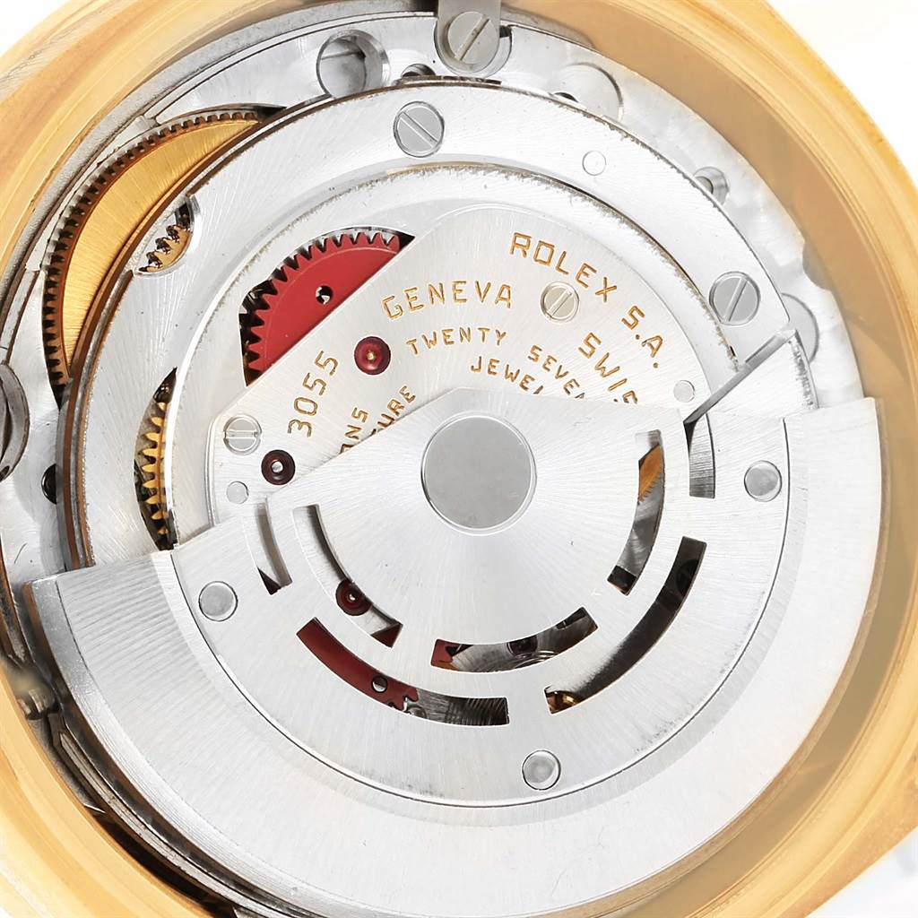 This image shows the internal mechanism of the Rolex President 18038 Men's Yellow Gold Black Dial 18038 Men's Yellow Gold Black Dial model, highlighting gears, screws, and the rotor from the back angle.
