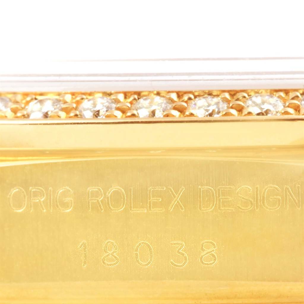 This image shows a close-up view of the Rolex President 18038 Men's Yellow Gold Black Dial 18038 Men's Yellow Gold Black Dial model's case with the model number and diamond-encrusted bezel.