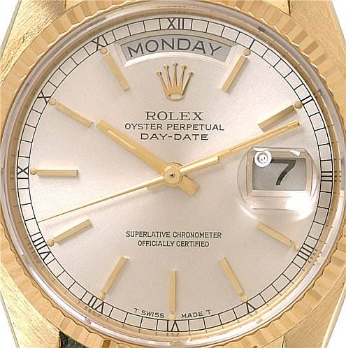 The image shows a close-up of the dial of a Rolex President 18038 Men's Yellow Gold Silver Dial 18038 Men's Yellow Gold Silver Dial Oyster Perpetual Day-Date watch, featuring the day and date windows.