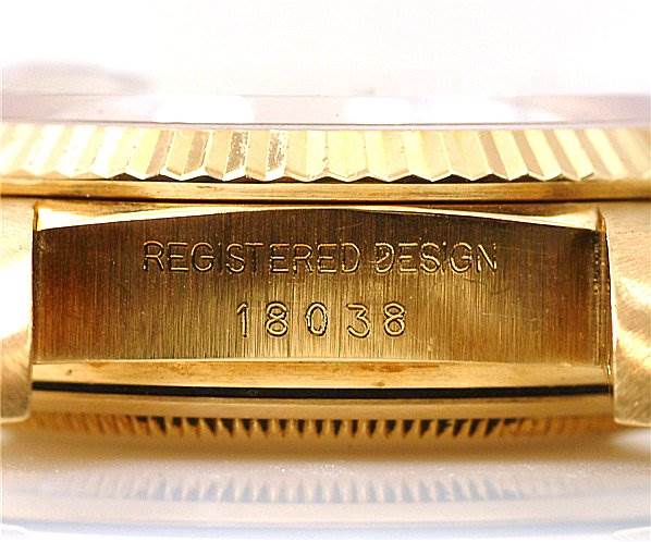 The image shows a side view of a Rolex President 18038 Men's Yellow Gold Silver Dial 18038 Men's Yellow Gold Silver Dial model, focusing on the engraved watch case with model number 18038.