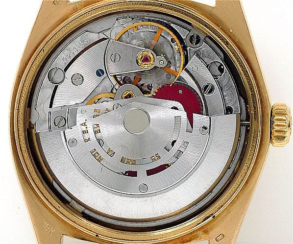 This image shows the back view of a Rolex President 18038 Men's Yellow Gold Silver Dial 18038 Men's Yellow Gold Silver Dial watch, revealing its intricate internal mechanical components.