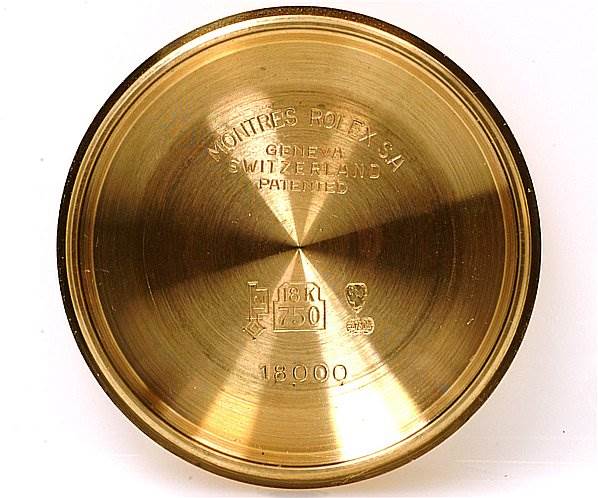 The image shows the inside of the case back for a Rolex President 18038 Men's Yellow Gold Silver Dial 18038 Men's Yellow Gold Silver Dial model watch, revealing branding and material markings.