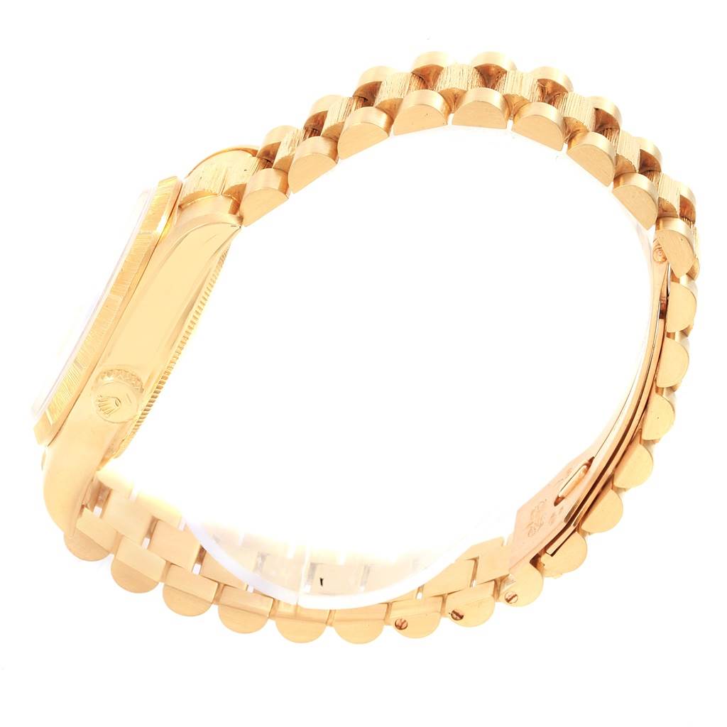 The image shows a side profile of the Rolex President 18078 Men
s Yellow Gold Champagne Dial 18078 Men
s Yellow Gold Champagne Dial model watch, highlighting the case and partially open bracelet.