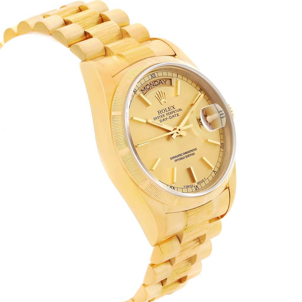 The image showcases a Rolex President 18078 Men
s Yellow Gold Champagne Dial 18078 Men
s Yellow Gold Champagne Dial watch at an angle highlighting the dial, bezel, and bracelet.