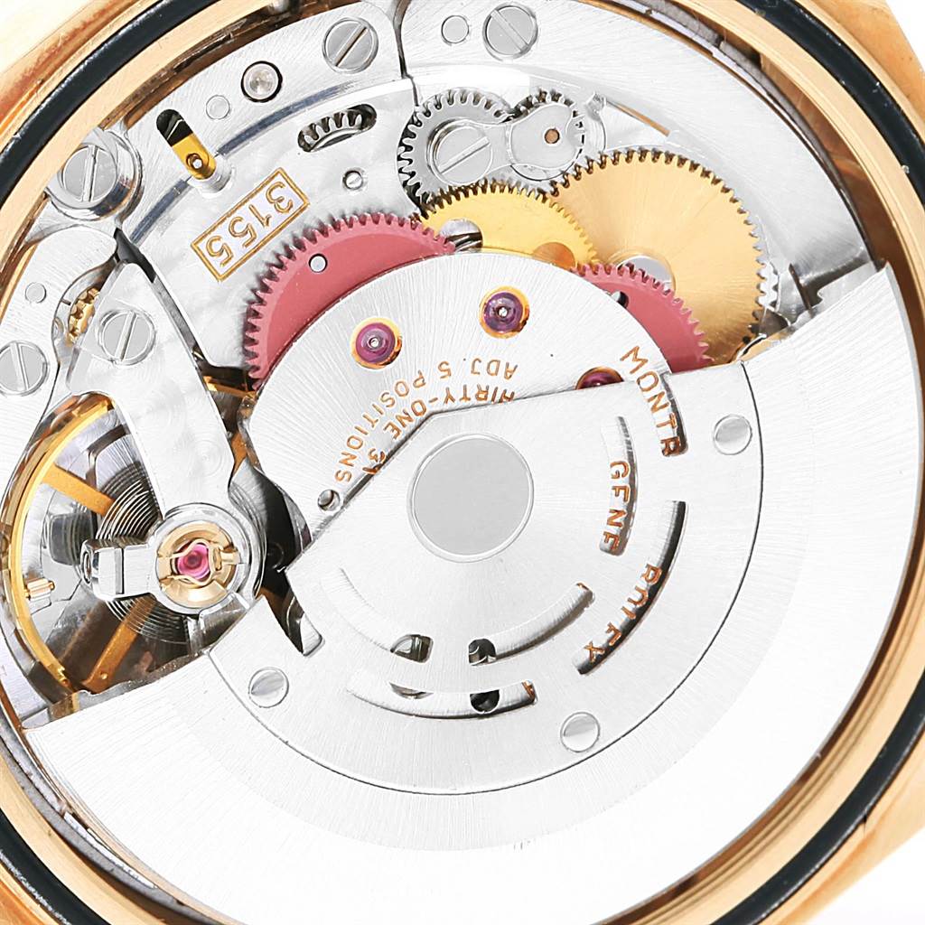 This close-up shows the intricate inner mechanism and gears of a Rolex President 18238 Men's Yellow Gold Black Dial 18238 Men's Yellow Gold Black Dial model watch.