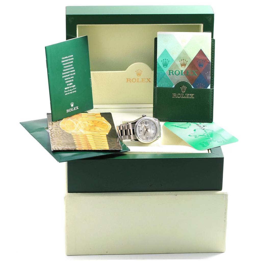 The Rolex President 118239 Men's White Gold Silver Dial 118239 Men's White Gold Silver Dial model watch is displayed with its box, booklets, and paperwork at an angled front view.
