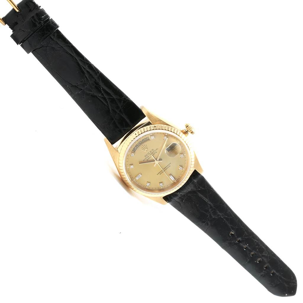 The Rolex President 18238 Men's Yellow Gold Champagne Dial 18238 Men's Yellow Gold Champagne Dial model watch is shown from a top-down angle, displaying the face, bezel, crown, and leather strap.