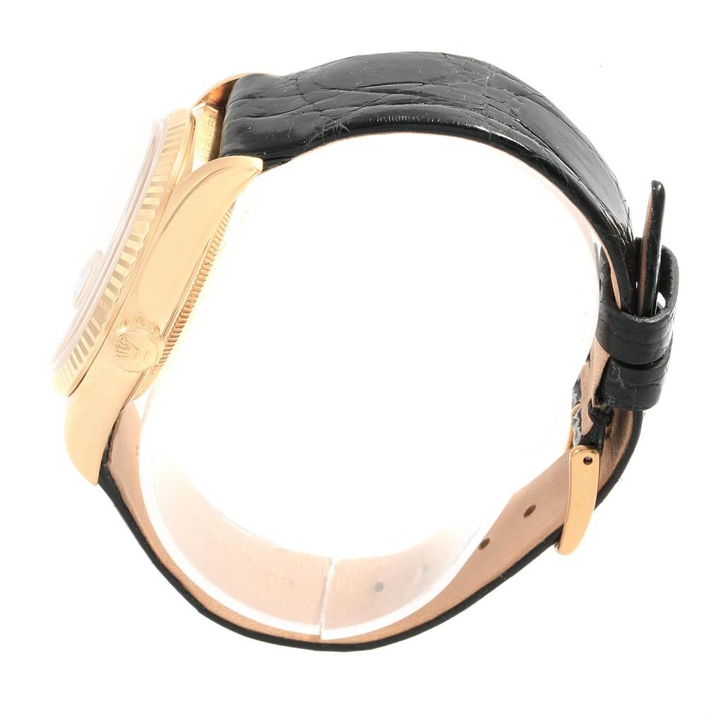 The image shows a side view of a Rolex President 18238 Men's Yellow Gold Champagne Dial 18238 Men's Yellow Gold Champagne Dial model watch with a gold case and black leather strap.