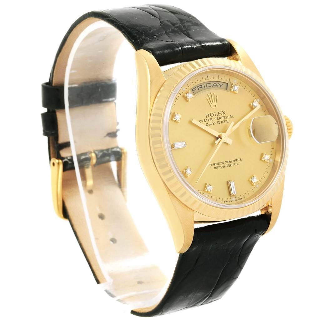 This Rolex President 18238 Men's Yellow Gold Champagne Dial 18238 Men's Yellow Gold Champagne Dial model watch is shown at an angled view highlighting the face, bezel, crown, and black leather strap.
