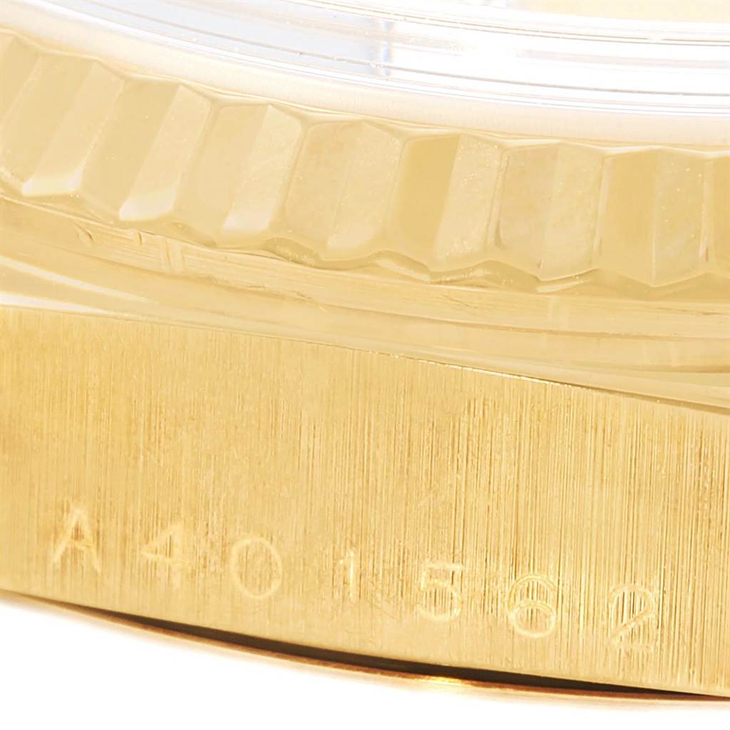 The image shows a close-up of the side bezel and serial number engraving on the Rolex President 18238 Men's Yellow Gold Champagne Dial 18238 Men's Yellow Gold Champagne Dial model.