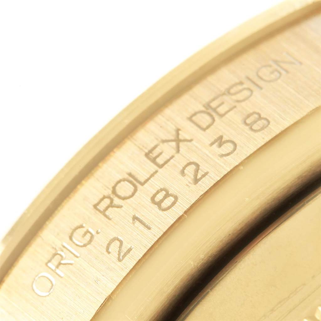 This close-up image focuses on the engraved text and serial number on the President model by Rolex.
