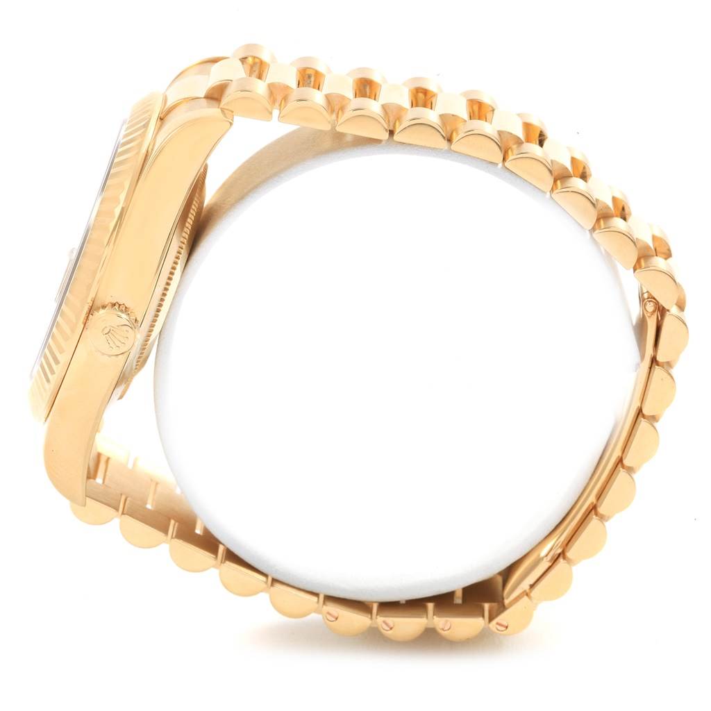 This is a side view angle showing the bracelet and casing of a Rolex President 218238 Men's Yellow Gold Champagne Dial 218238 Men's Yellow Gold Champagne Dial model watch.