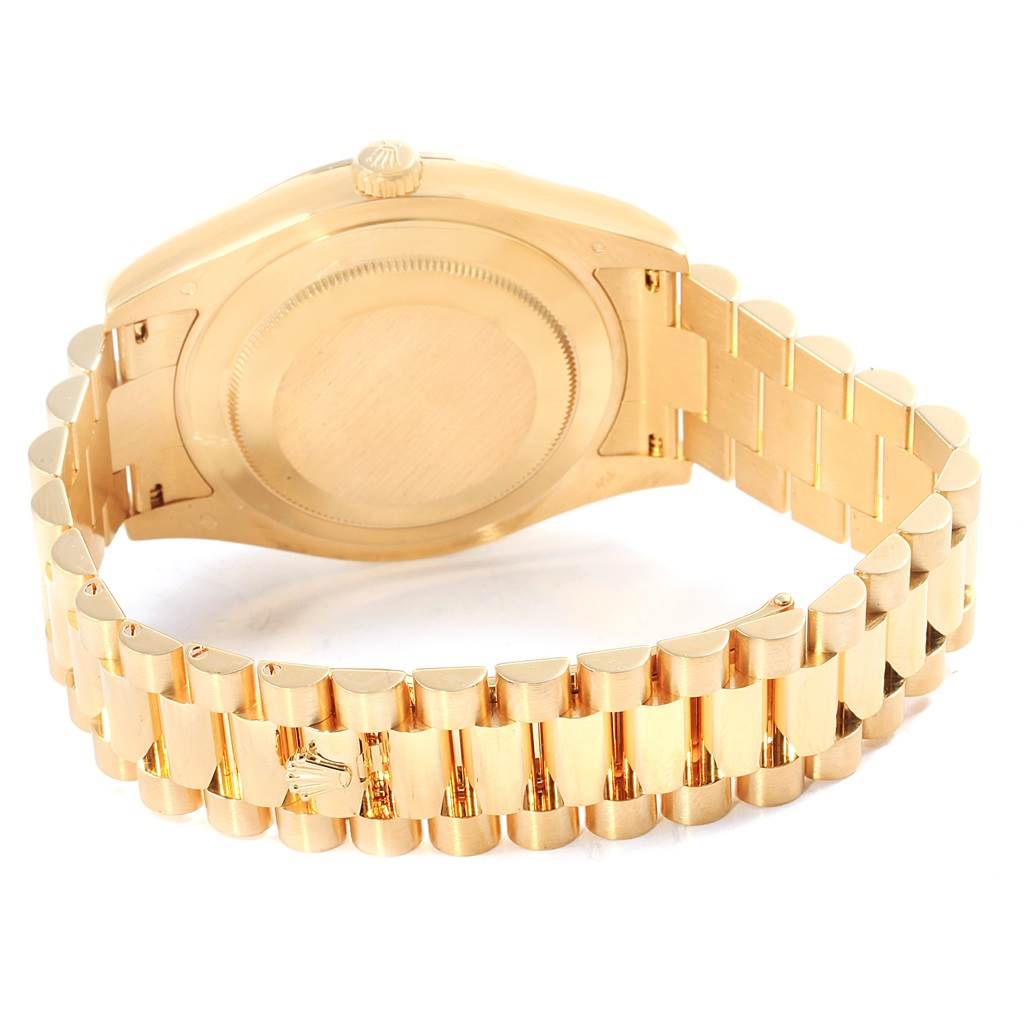 The image shows the backside of the Rolex President 218238 Men's Yellow Gold Champagne Dial 218238 Men's Yellow Gold Champagne Dial model, including the case back and part of the bracelet.