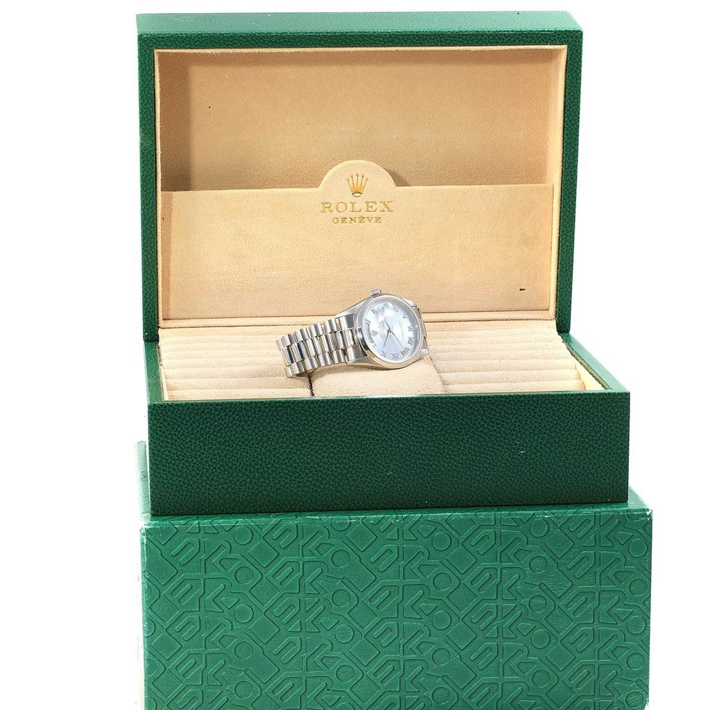 The Rolex President 18206 Men's Platinum Blue Dial 18206 Men's Platinum Blue Dial model watch is shown in its open green Rolex box, featuring the watch face and bracelet.