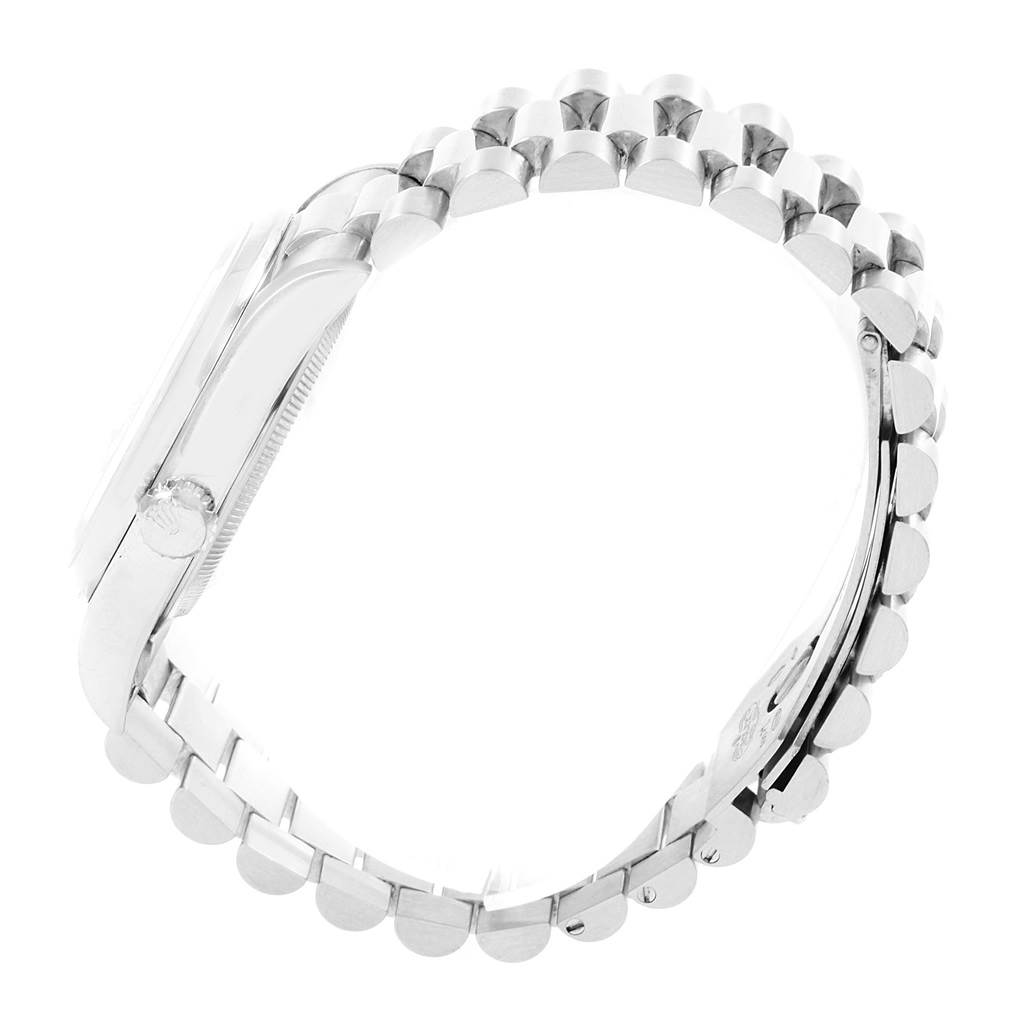 The image shows a side view of a Rolex President 18206 Men's Platinum Blue Dial 18206 Men's Platinum Blue Dial model watch, highlighting its bracelet and crown.